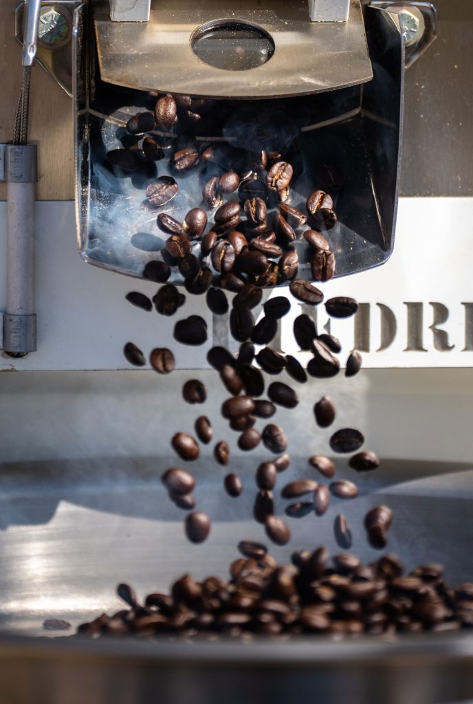 <strong>SOLAR-ROASTED</strong> — Coffee beans roasted using solar energy drop from a roaster at the National Solar Thermal Test Facility at Sandia. The project is a funded by the state of New Mexico.