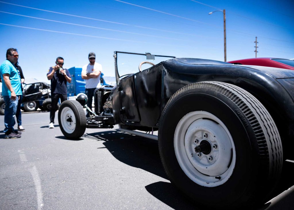 <strong>BETTER WITH AGE</strong> — Austin Pisani admires his 1927 Ford Model T with spectators at the show. Alexandria Bates, who helped organize and plan the event, said participants registered nearly 100 cars this year. The event was open to all Sandia and Kirtland employees and their cars, trucks, street rods, rat rods and motorcycles.