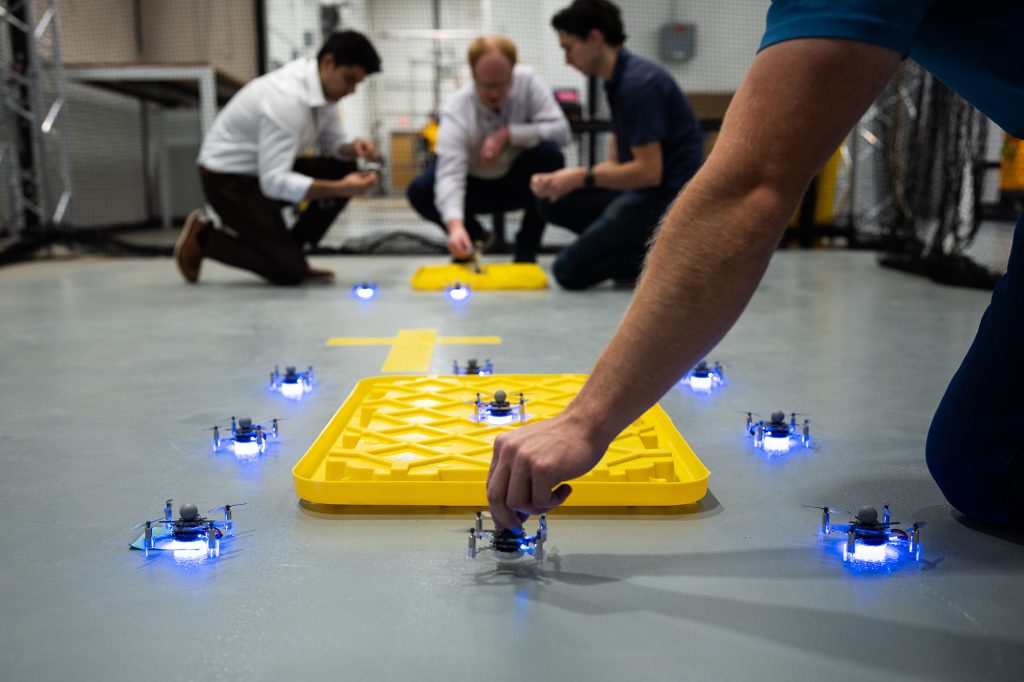 <strong>READY OR NOT</strong> — Sandia intern Cole Lill helps set up drones for a test at Sandia’s Center for Advanced Manufacturing and Innovation.