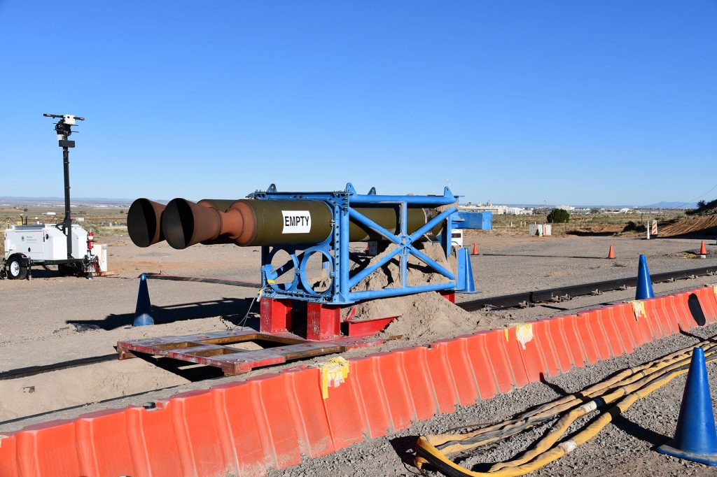 <strong>TEST ENVIRONMENT</strong> — The Nike rocket motors and the pusher sled that propelled the Mobile Guardian Transporter Prototype 2 test vehicle down the track rest in the sand brake trough used to stop the sled. (Photo by Michael Ludwig)