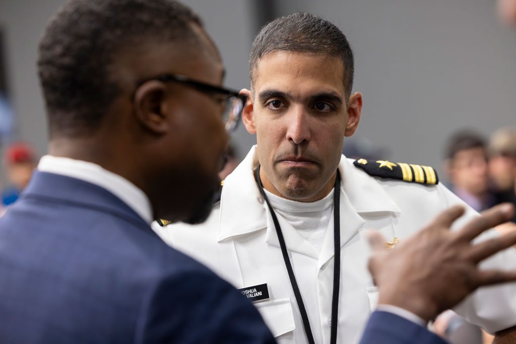 <strong>EARLY DELIVERY</strong> — Pantex Field Office Deputy Manager Marcus Lea, left, speaks to Cmdr. Joshua Valiani, U.S. Navy, during a gathering at the Pantex Plant in Amarillo, Texas, to celebrate completion of the first production unit of the W76 Mark 4B reentry body. (Photo courtesy of Pantex)