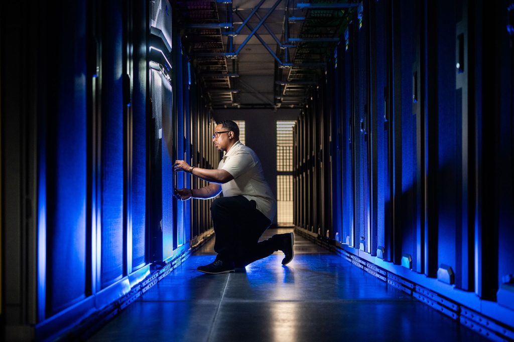 <strong>DATA DELIVERERS</strong> — Drew Portis is part of the group of people who manage the data center in Livermore that provides the computing infrastructure in California and a backup for systems in New Mexico. (Photo by Craig Fritz)