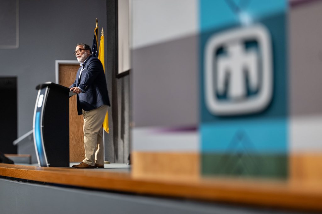 <strong>INSTRUMENT OF DETERRENCE</strong> — Harry Coker Jr., the nation’s cyber director from 2023-2025, addresses in-person and online audiences at Sandia as part of the Labs’ National Security Speaker Series Aug. 11 on “Leading in Cybersecurity for National Security.” Coker is Maryland’s commerce secretary, a retired CIA senior executive, a former National Security Agency senior executive and a career naval officer.<br>He said that cybersecurity has expanded beyond protecting information technology to safeguarding operational technologies critical to national infrastructure and public trust.<br>“The nations that lead will not necessarily be those that invent the most extraordinary technologies. They will be the nations that most integrate those technologies into their economies, into their institutions, into their security and ultimately into the national strategy."<br>Resilience has become “an instrument of deterrence,” Coker said. “Cyber resilience, economic resilience, supply chain resilience, space resilience and societal resilience all deny an adversary of the strategic effects that they would seek. And a resilient nation is more difficult to coerce; a trusted society is more difficult to divide; and a secure digital infrastructure is more difficult to exploit. In that sense, cybersecurity does not merely support deterrence. It increasingly enables it,” Coker said.<br>Sandia staff can view Coker’s talk in the Digital Media Library. (Photo by Craig Fritz)