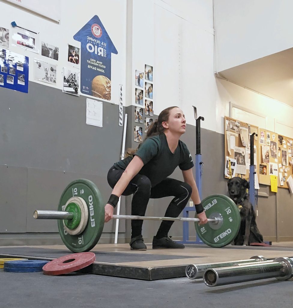 <strong>STRENGTH TRAINING</strong> — Jenna deCastro trains for an Olympic weightlifting competition. (Photo courtesy of Jenna deCastro)