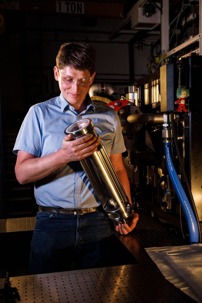 <strong>VISION</strong> — Combustion researcher Ales Srna examines the optical cylinder that was installed in one of Sandia’s most up-to-date laboratories. (Photo by Spencer Toy)