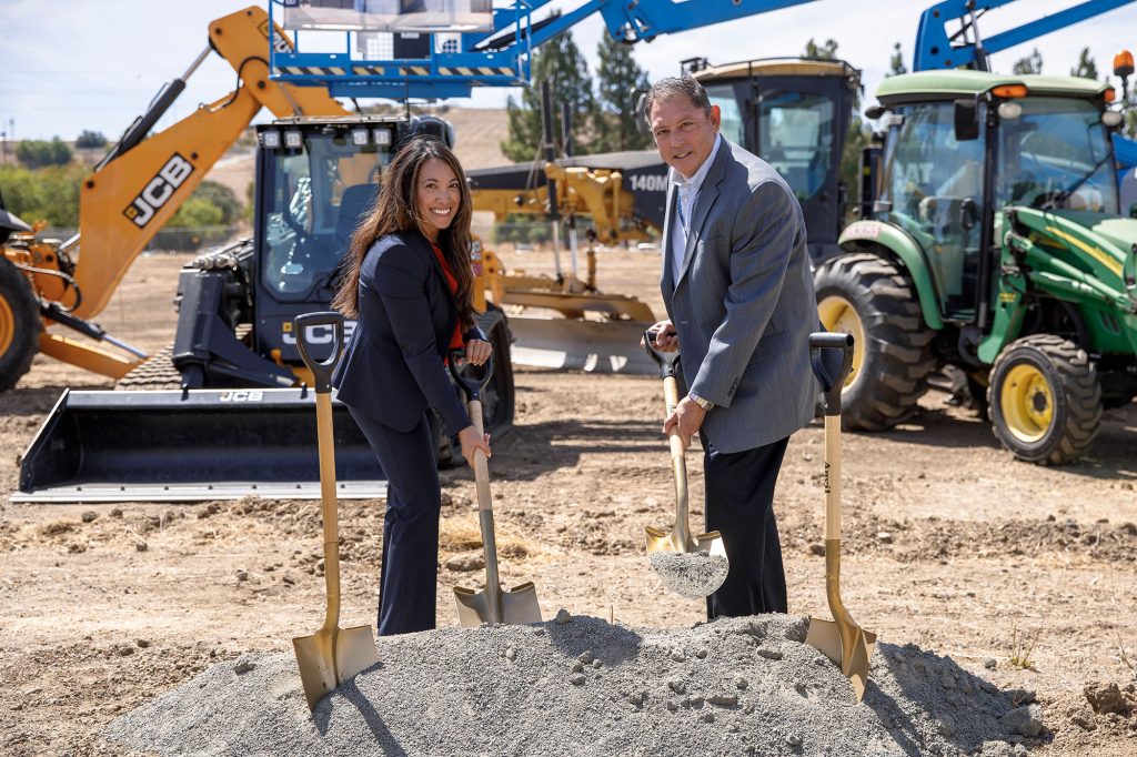 <strong>SHOVELING A NEW START</strong> — Operations Director Trish Benguerel and NNSA Sandia Field Officer Phil Duarte pose for the ceremonial groundbreaking of the Secure Weapons Integration Center. (Photo by Spencer Toy)