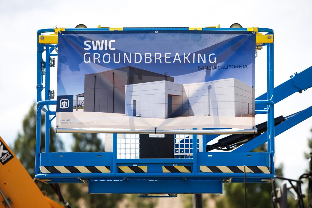 <strong>INFRASTRUCTURE INVESTMENT</strong> — An image of the building design for SWIC hangs from construction equipment at the groundbreaking ceremony. (Photo by Spencer Toy)