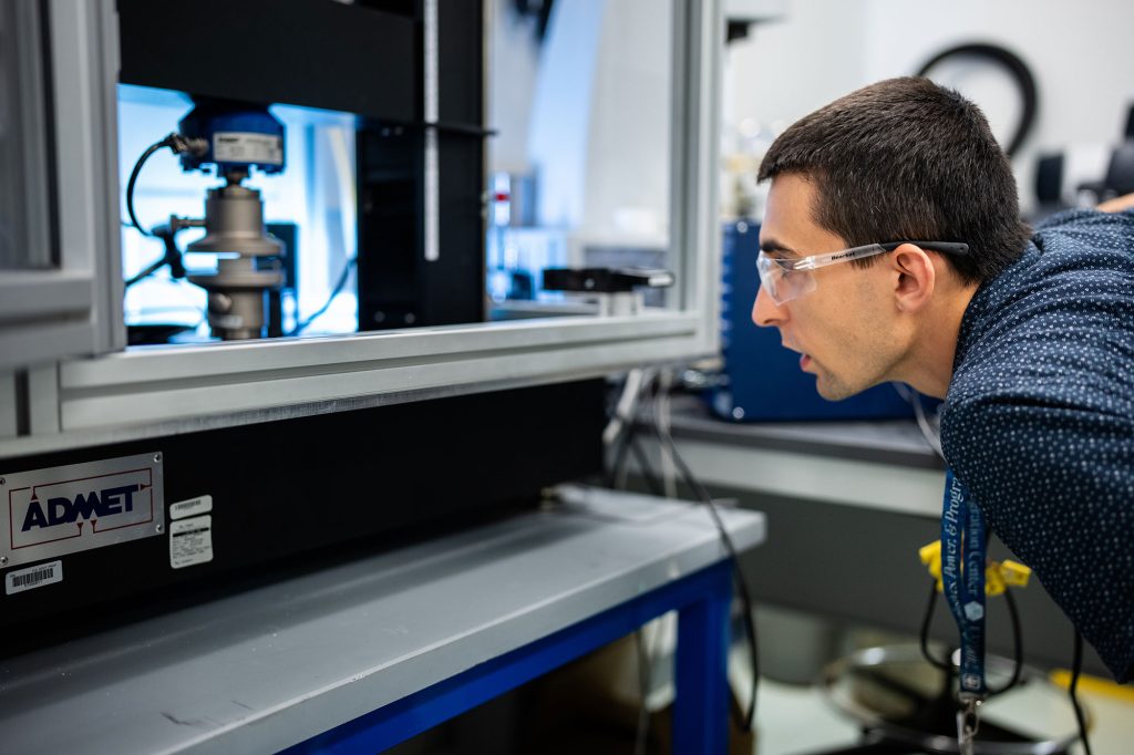 <strong>RAPID RESULTS </strong>— A Sandia employee conducts mechanical testing of a surrogate material at the Center for Advanced Manufacturing and Innovation. The new material was manufactured in hours instead of weeks.