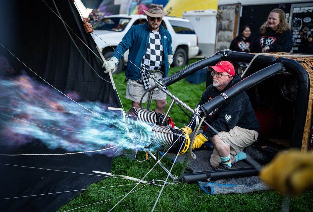 <strong>FIRING UP </strong>— Eric Hodges fires up his balloon’s burner as he prepares to take off on the first day of his 41st consecutive Balloon Fiesta on Oct. 3. (Photo by Craig Fritz)
