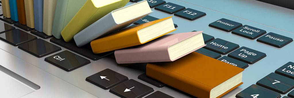 E-learning concept. Books stacked on a computer keyboard. 3d illustration